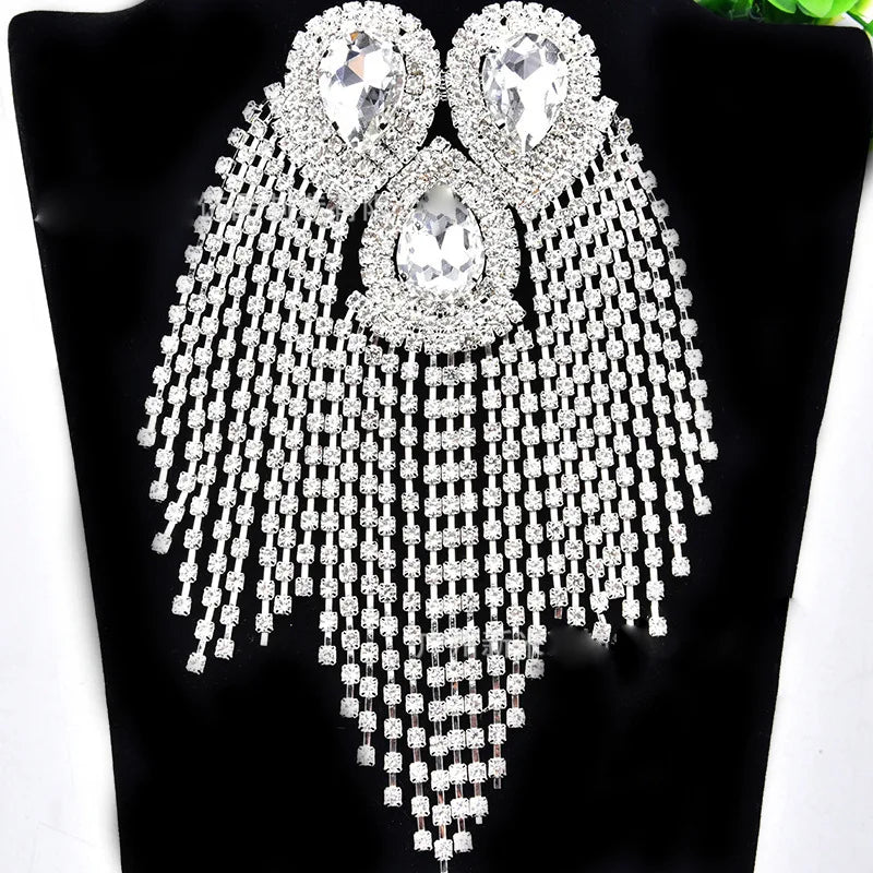 Ornate rhinestone shoulder brooch pin on black background