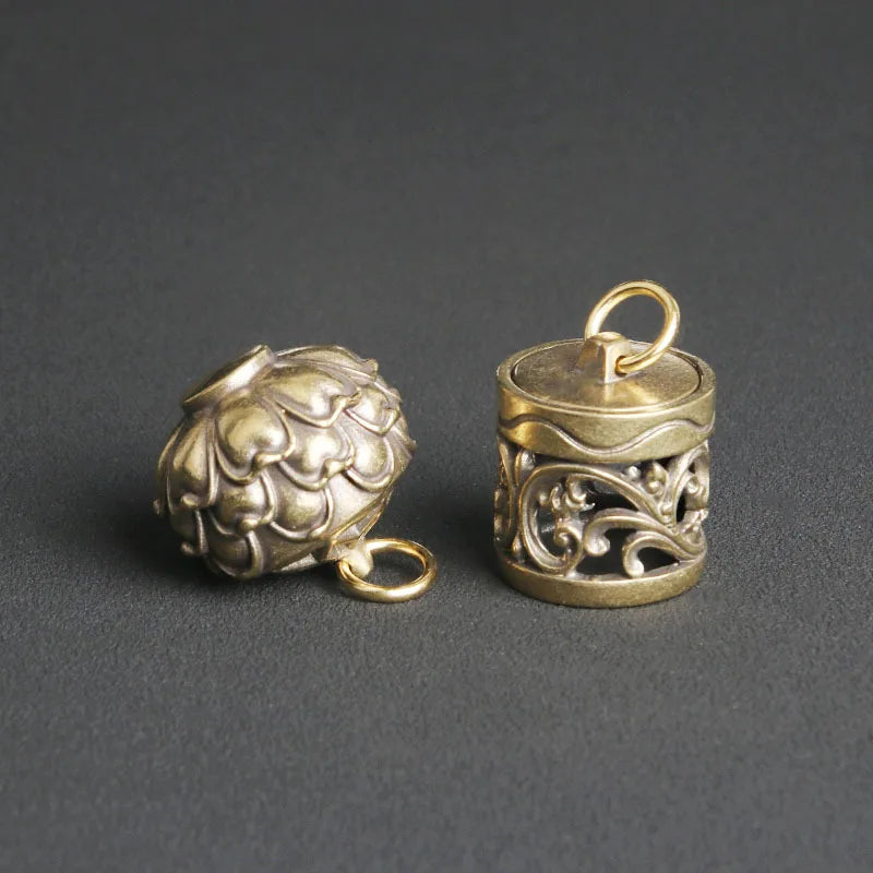 Vintage brass keepsake charm with detachable lid and lotus pattern