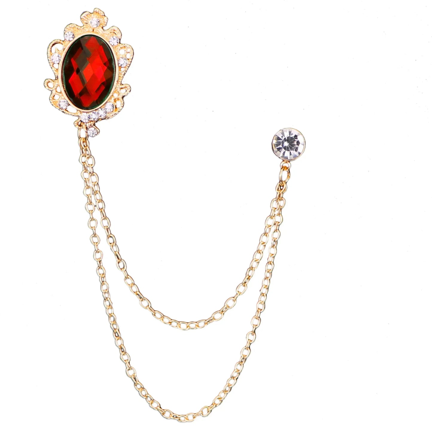 Gold brooch with red gemstone and chain on a white background