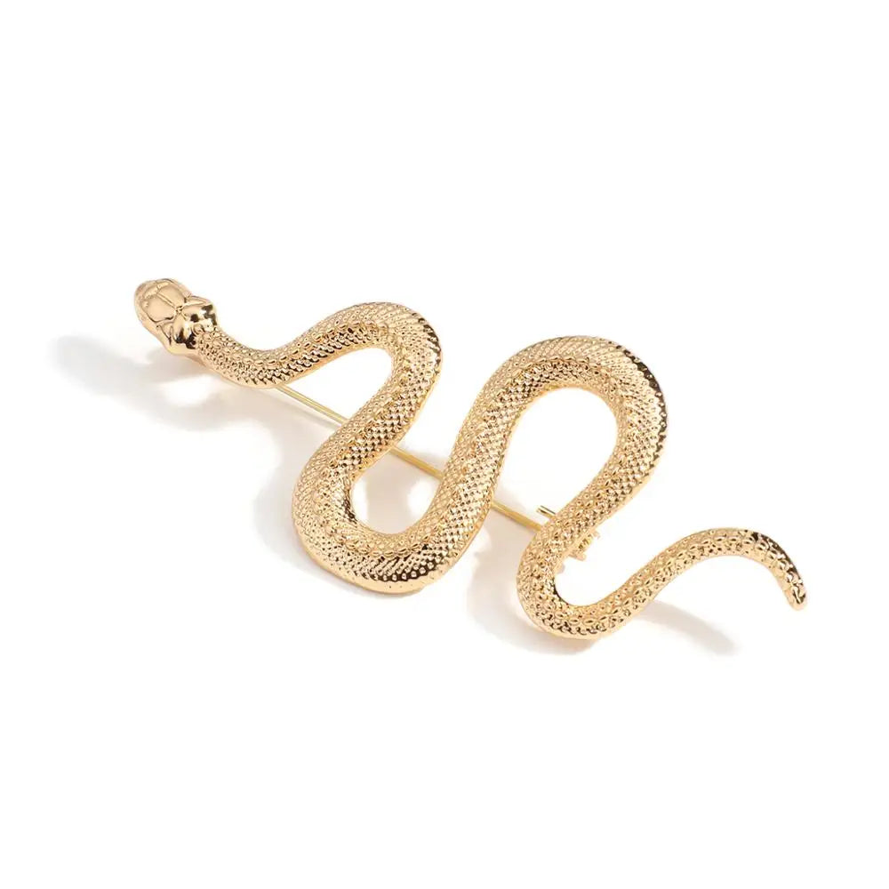 Luxury gold snake brooch pin isolated on white background.