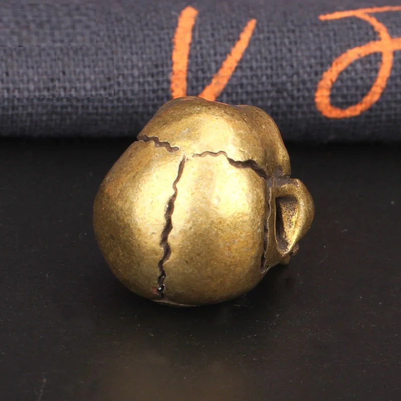 back side view of Solid brass skull head figurine with antique finish for gothic home decor, office desk decoration, and collectible display