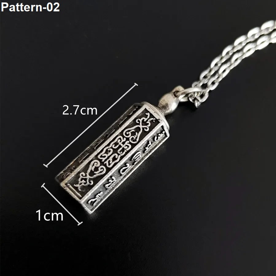 Silver pendant necklace with measurements on a black background
