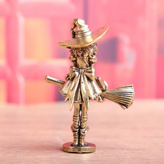 Vintage witch princess figurine sitting on a broom with antique bronze finish decorative home ornament