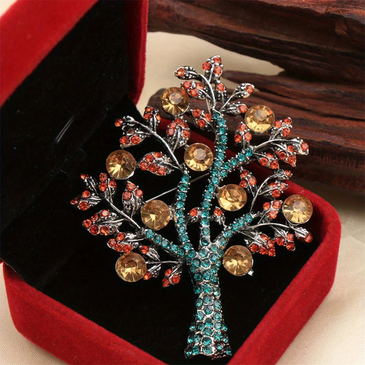 Decorative money tree brooch with colorful gemstones in jewelry box