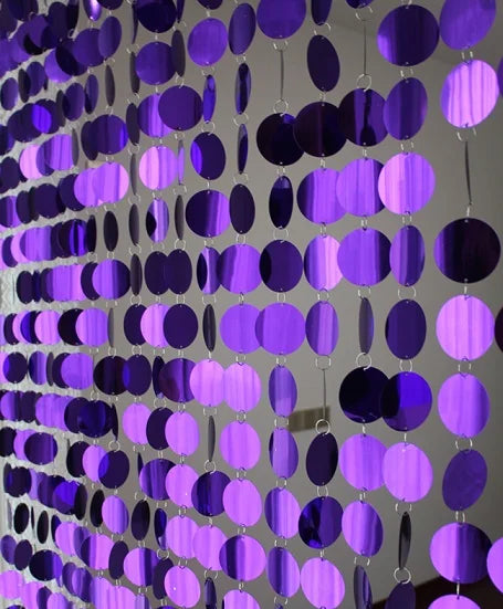 purple round sequin curtain on a plain background