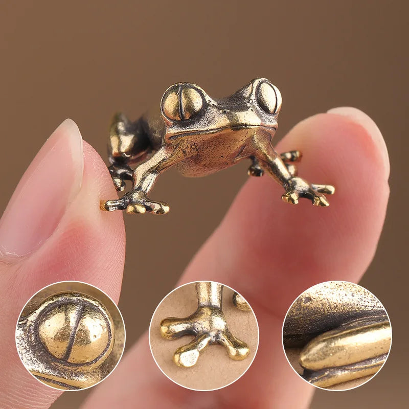 Bronze frog figurine held between fingers with close-up insets showing texture details.