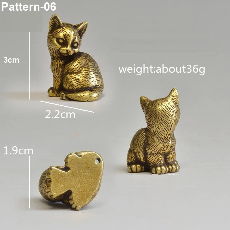 Gold cat figurine with measurements and weight information on a gray background