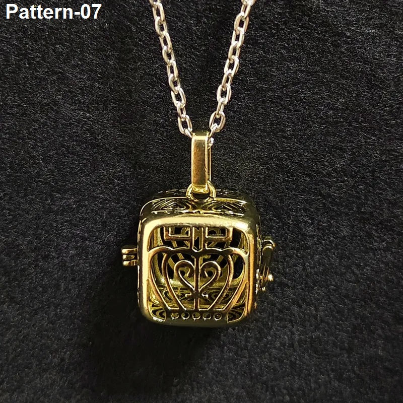 Gold pendant necklace with intricate design on a dark background