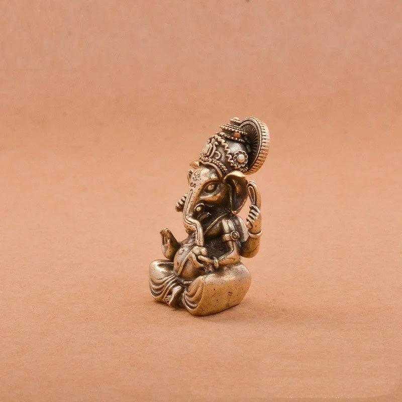 Mini brass Ganesha figurine with antique finish