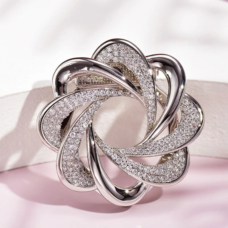 Silver interlocking ring jewelry piece elegant fashion accessory on soft pink background