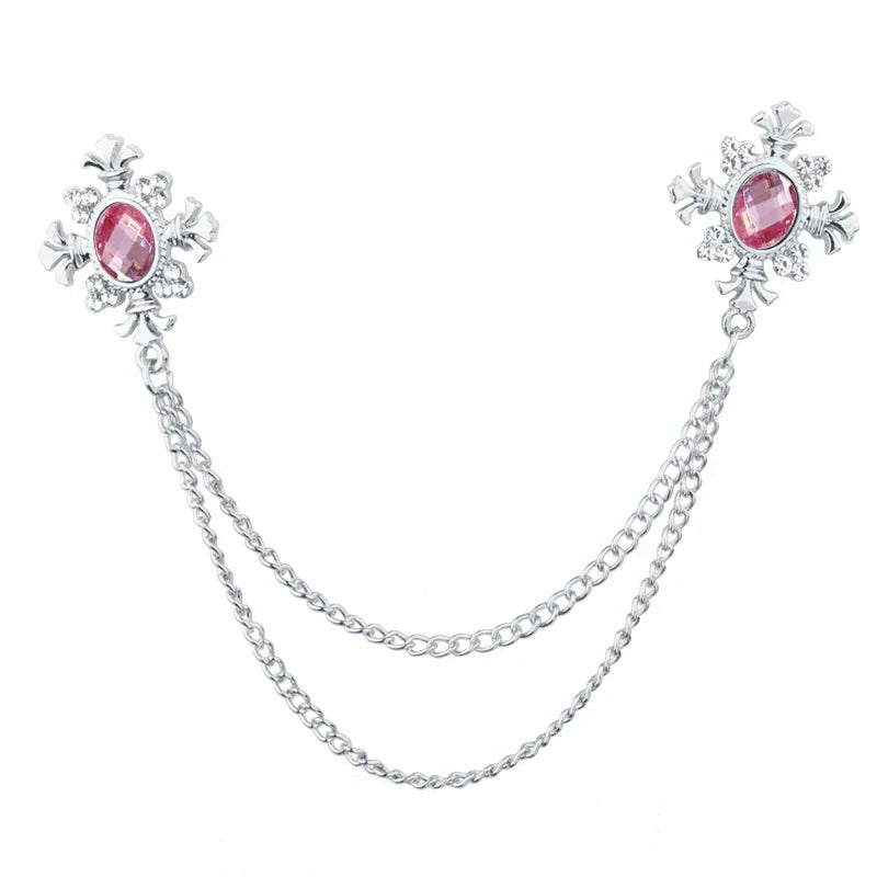 Silver Pink Crystal cross chain brooch pins with gemstone accents on white background.
