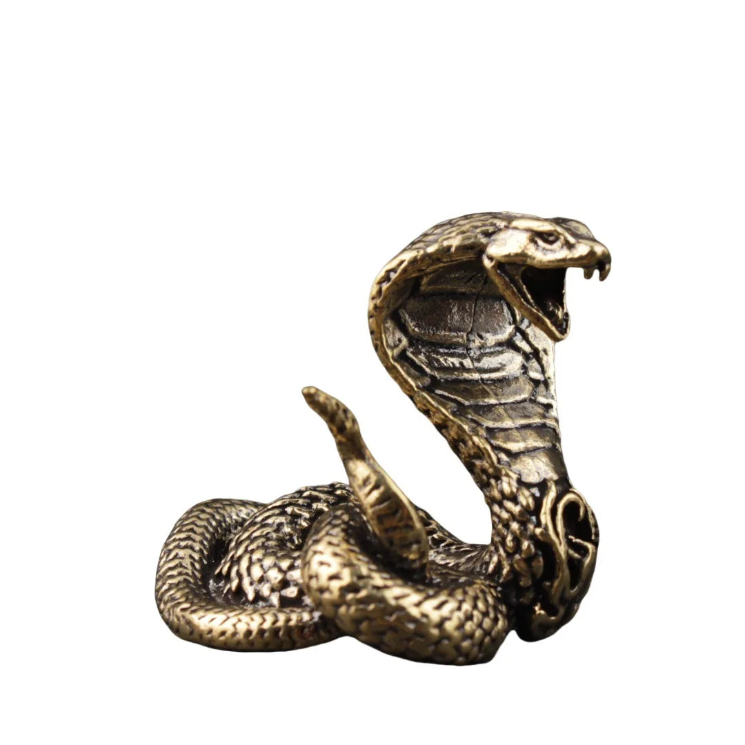 Lucky brass snake statue for tea table and home decor on white background