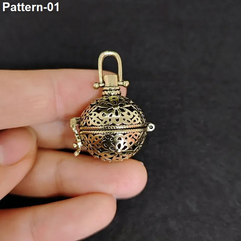 Vintage brass hollow ball locket pendant with black cord necklace