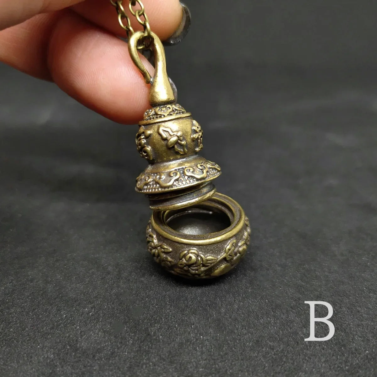 Decorative keepsake necklace featuring traditional gourd container pendant design