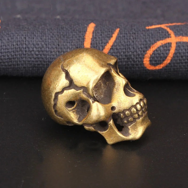 another side view of Solid brass skull head figurine with antique finish for gothic home decor, office desk decoration, and collectible display