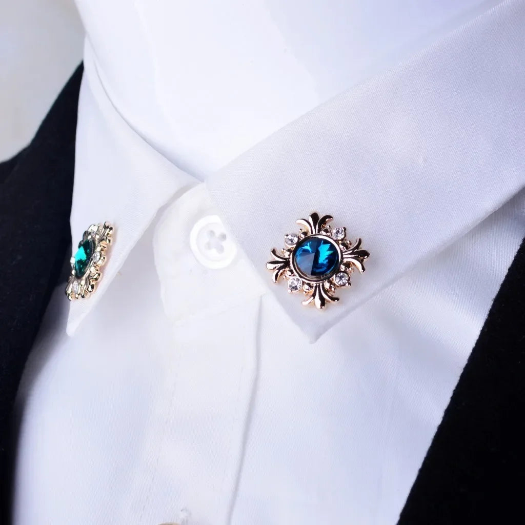 Crystal cross brooch pins with rhinestones styled on shirt collar cuff luxury fashion jewelry on white background