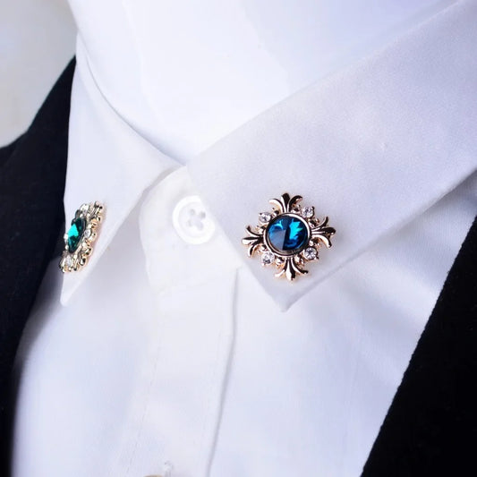 Crystal cross brooch pins with rhinestones styled on shirt collar cuff luxury fashion jewelry on white background