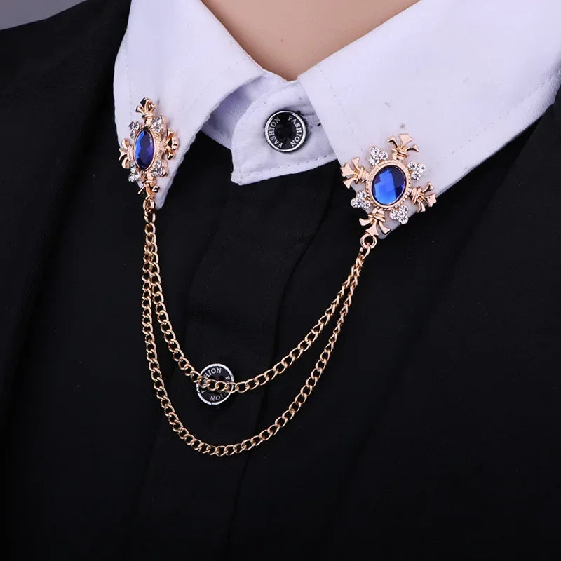 Crystal cross chain brooch pins styled on a white shirt collar with double decorative chains