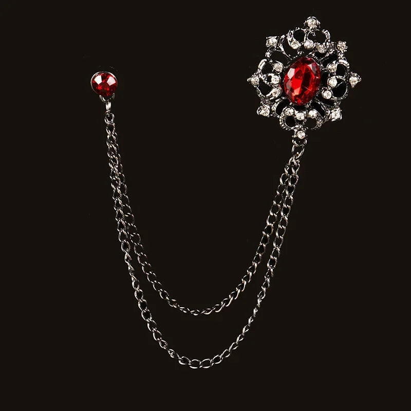 Decorative red gemstone brooch with elegant chain accessory