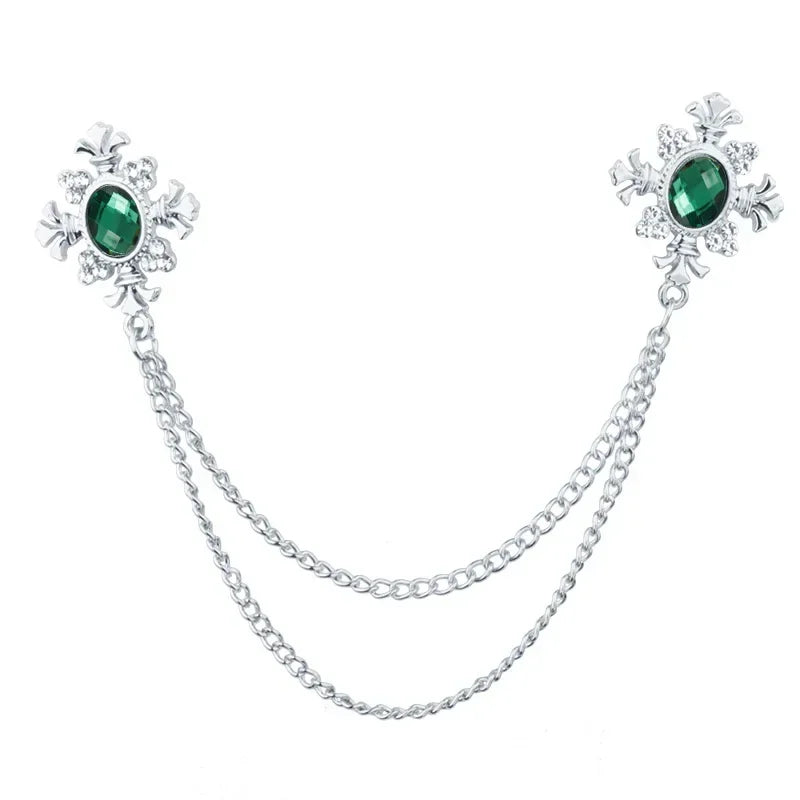 Silver Green Crystal cross chain brooch pins with gemstone accents on white background.