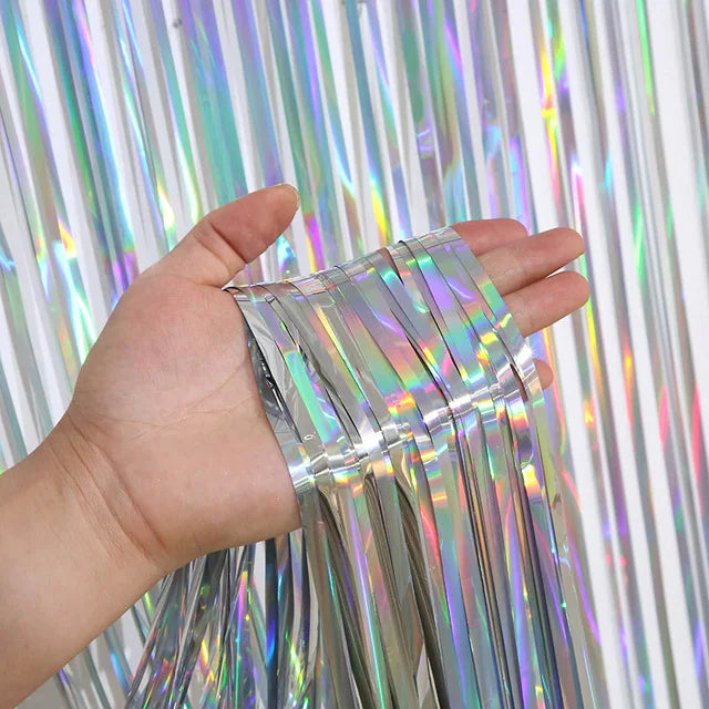 Close up of holographic foil fringe curtain material with shimmering reflective finish