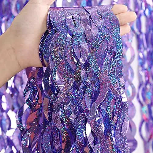 Close up of premium purple metallic tinsel fringe curtain with sparkling textured finish