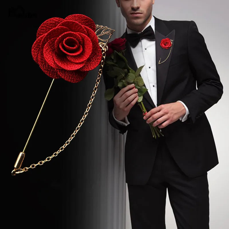 Man in black tuxedo holding red rose with matching red rose lapel pin formal fashion style