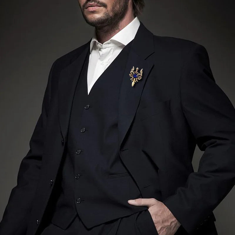 Man wearing black suit and white shirt with luxury brooch lapel pin formal wear style