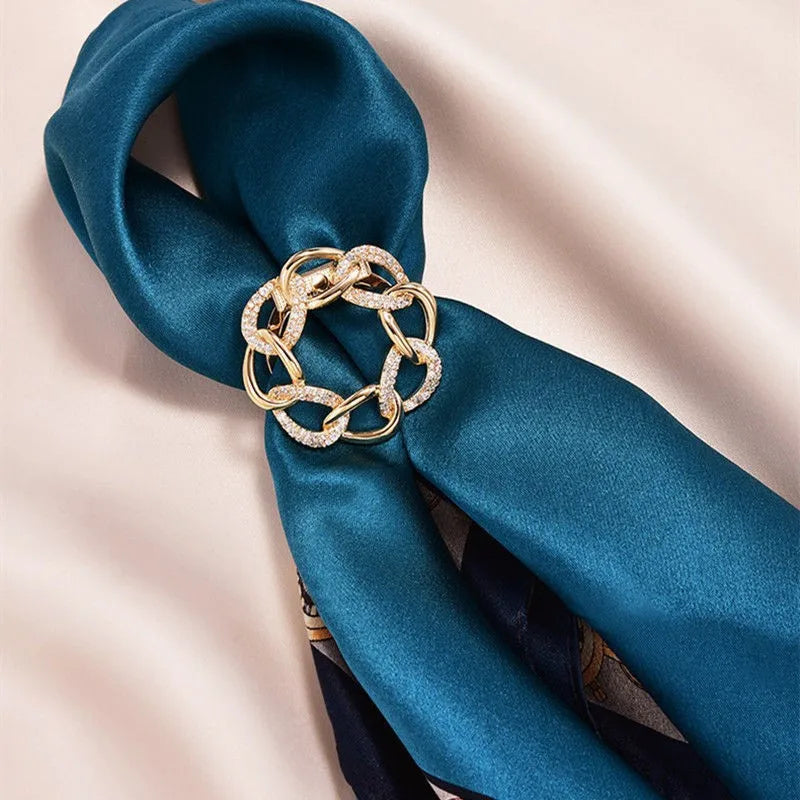 Gold chain napkin ring luxury tableware accessory on blue satin napkin elegant dining decor
