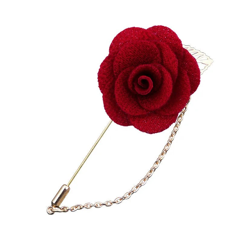 Red flower shaped brooch with chain elegant fashion jewelry accessory on white background
