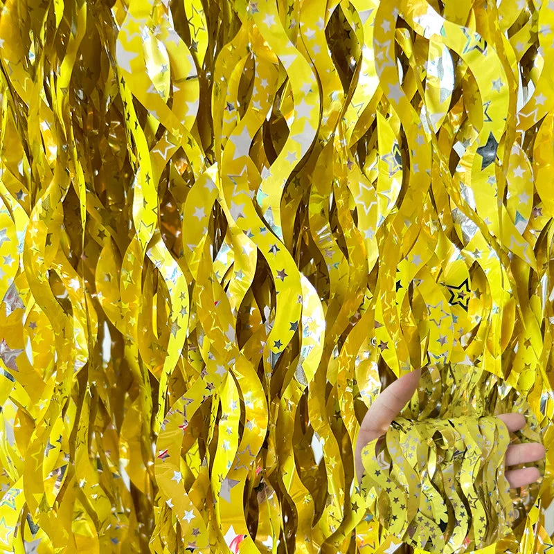 Yellow star fringe curtain backdrop for festive party decor and event styling