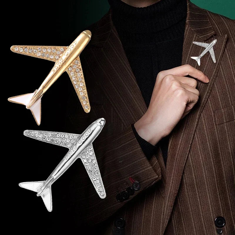 Person wearing brown pinstripe suit with airplane brooch pins formal fashion style