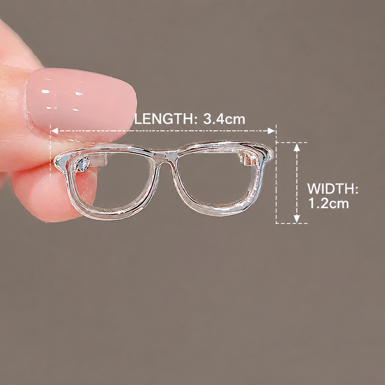 Cute glasses brooch with size measurement details on brown background