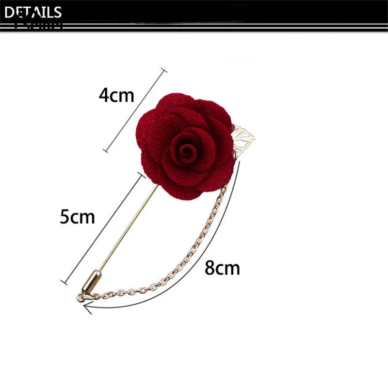 Red rose brooch with chain, shown with measurements on a white background