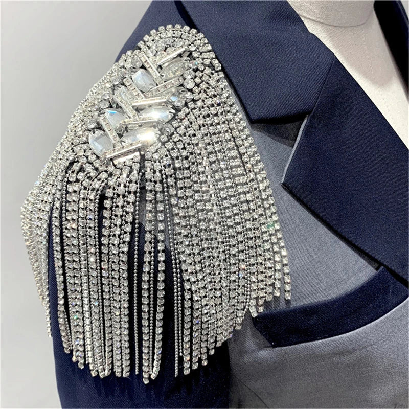 Elegant rhinestone tassel brooch on navy blue garment