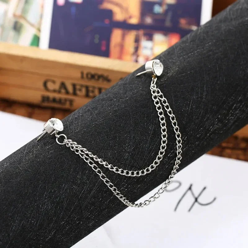 Silver double chain brooch pin displayed on black velvet background