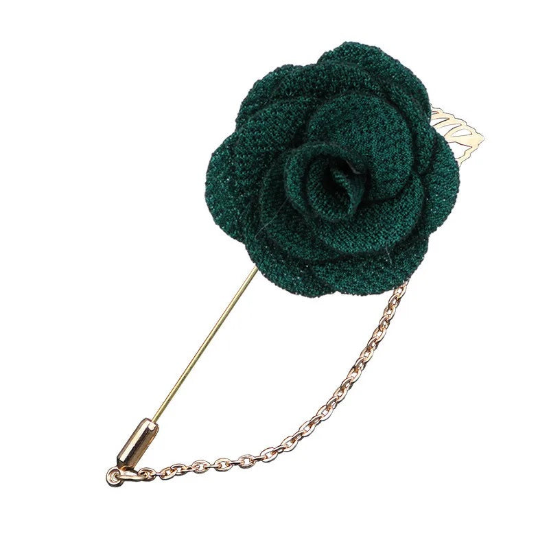 Green flower shaped brooch with chain elegant fashion jewelry accessory on white background