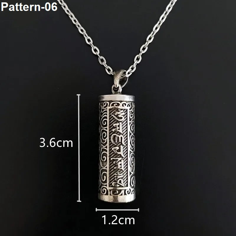 Silver pendant necklace with measurements on a black background