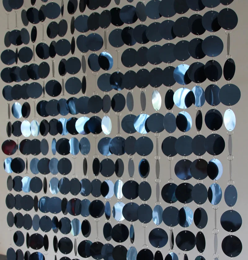 Decorative sequin curtain with black and silver circular patterns