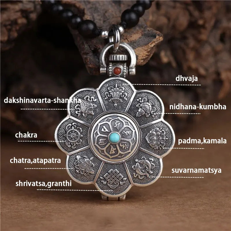 Antique lotus locket pendant with intricate engraved patterns on wooden background