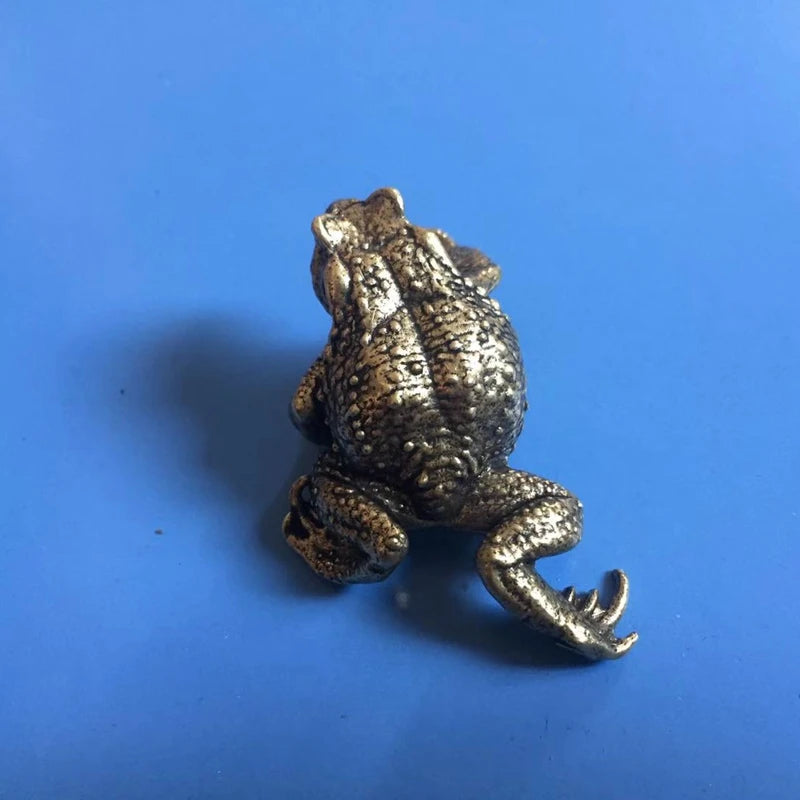 Solid brass toad sculpture for office desk, shelf, and tea pet display