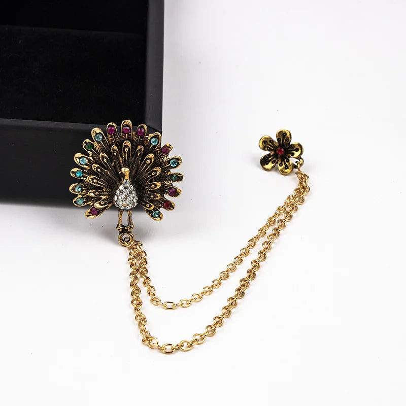 Peacock feather design brooch with chain elegant fashion jewelry on white background