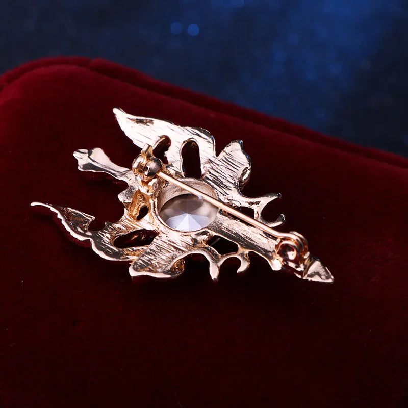 Elegant decorative brooch displayed on red cushion premium fashion jewelry accessory