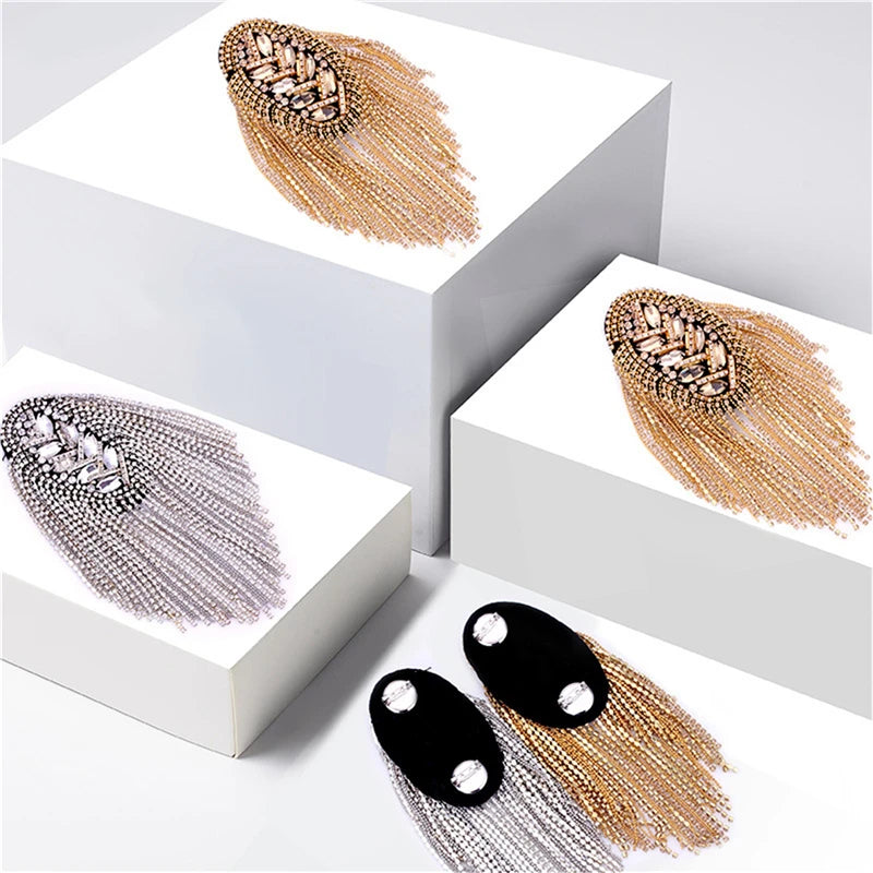 Luxury tassel shoulder jewelry displayed on white background