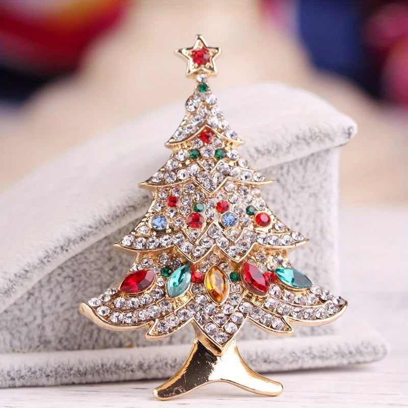Decorative Christmas tree brooch with colorful crystal gemstones on white background