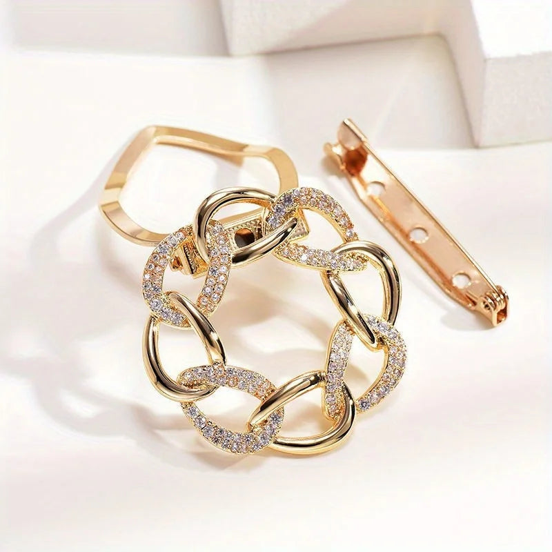 Gold interlocking chain bracelet luxury fashion jewelry on light background close up