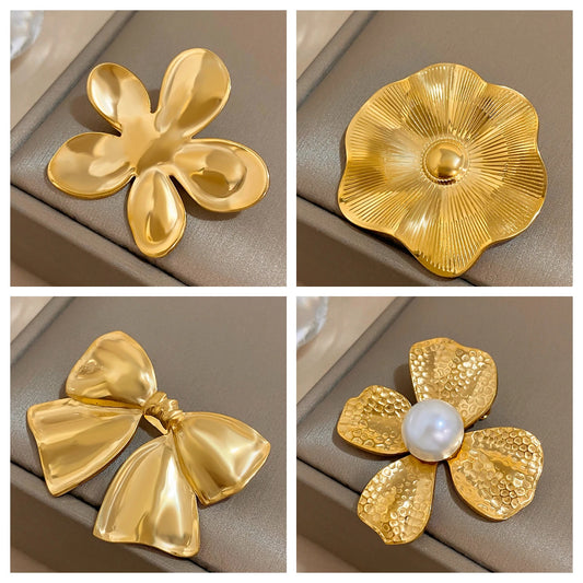 starfish, bow Collage of various gold brooches with on a beige background