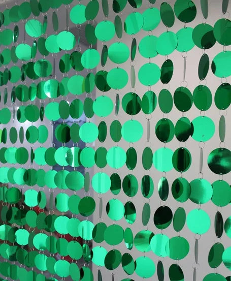 Green circular sequin curtain on a gray background