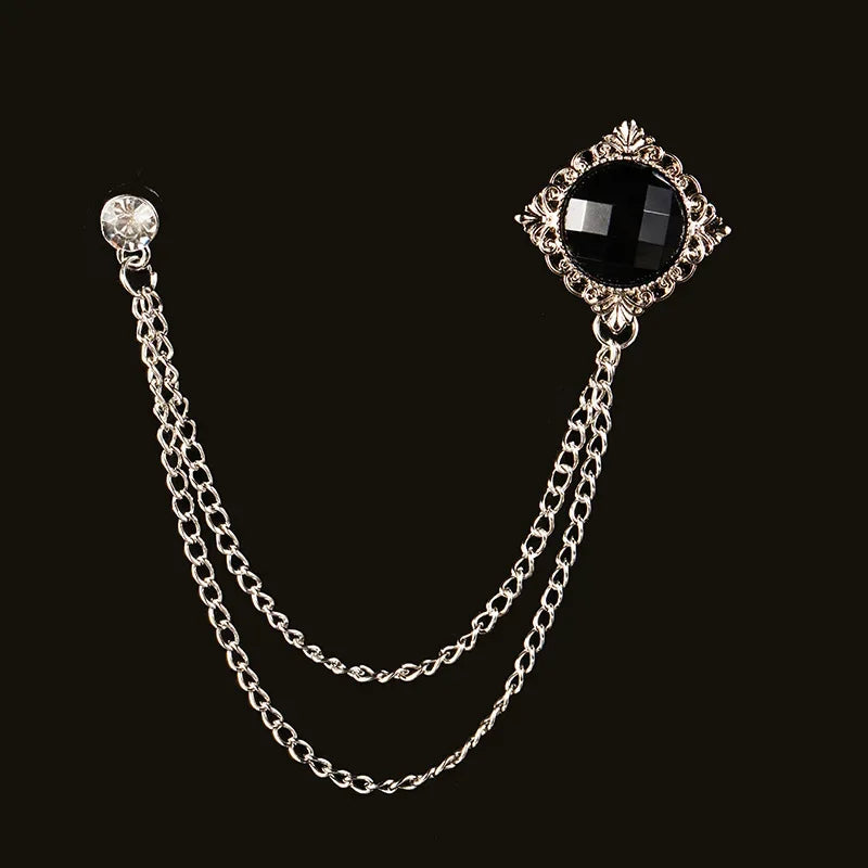 Silver brooch with black gemstone and double chain design