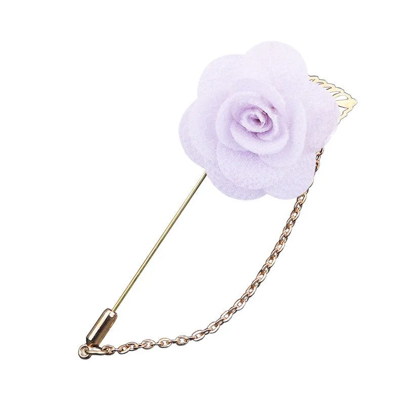 White flower shaped brooch with chain elegant fashion jewelry accessory on white background